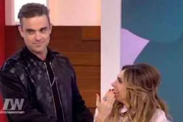 Robbie Williams confronts his wife on Live TV after she says she fakes it with him